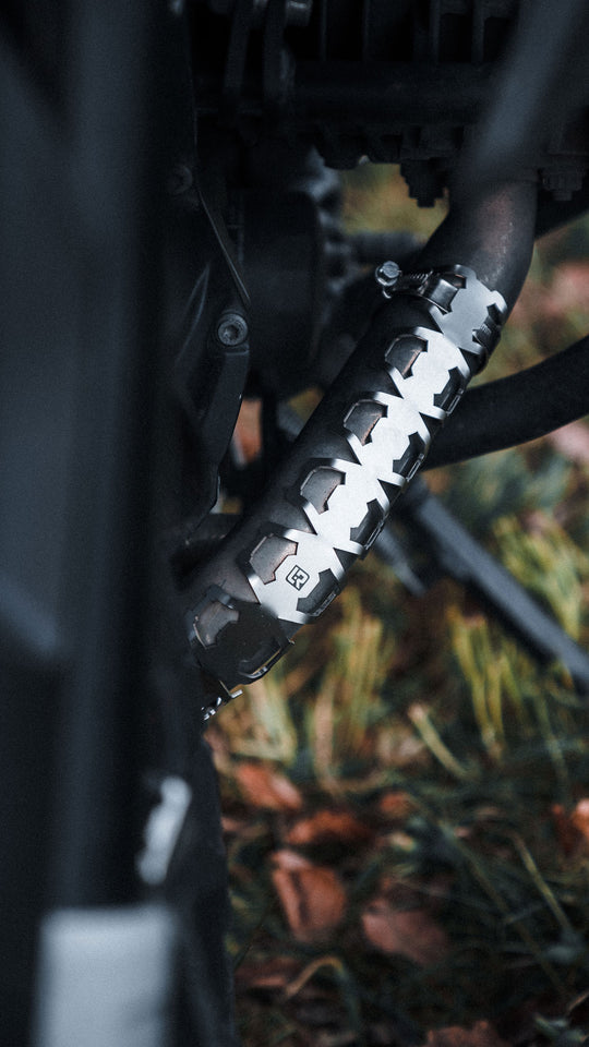 Exhaust Manifold  Protection installed on a bike protecting the metal parts
