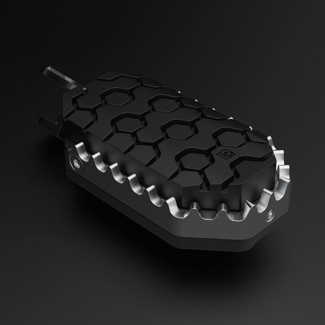 Image of one motorcycle foot peg with rubber to protect a boot