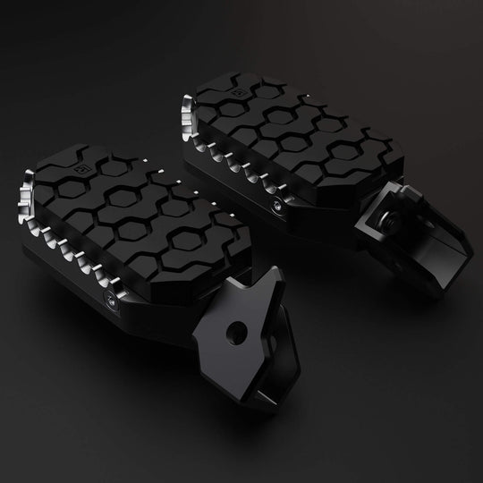 Image of Two motorcycle foot peg with rubber to protect a boot